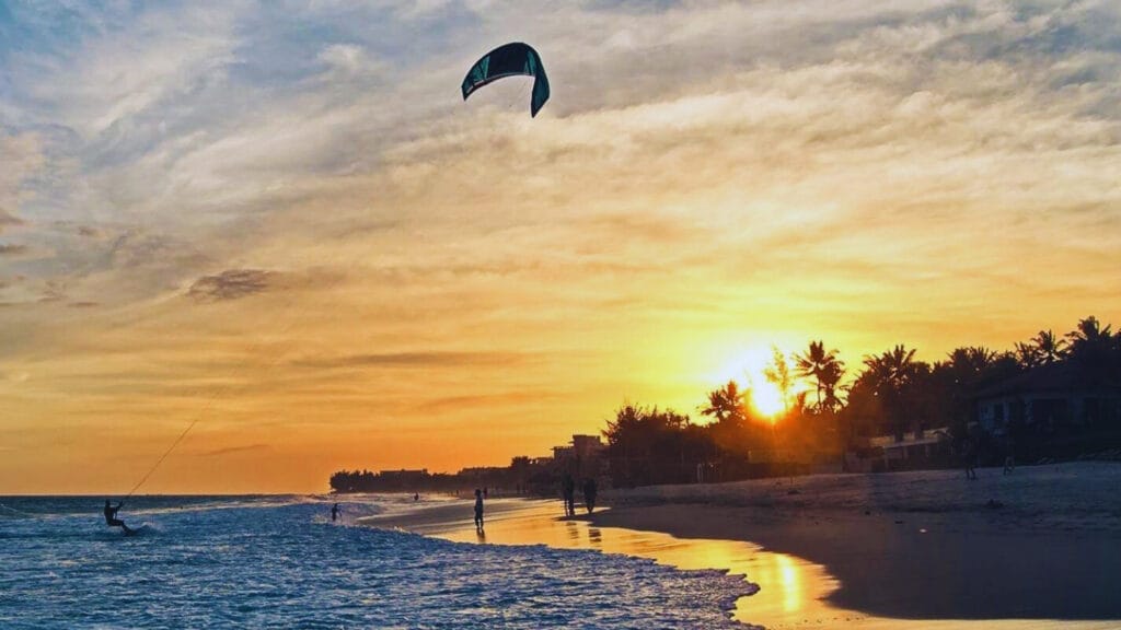 Mui Ne Travel Guide 2026: Vietnam’s Best Beach Escape for Sand Dunes, Seafood & Kitesurfing 9 Kitesurfing in Mui Ne, Vietnam during sunset