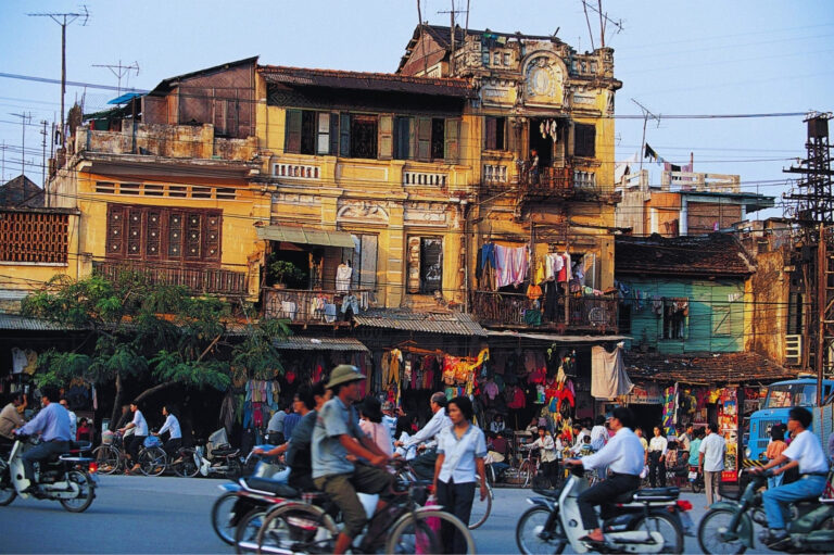 Is Vietnam Safe for Tourists? Tourists crossing a busy street in Hanoi Vietnam