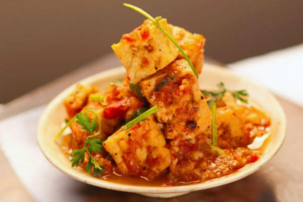 Vietnamese tofu cooked in tomato sauce served with steamed rice