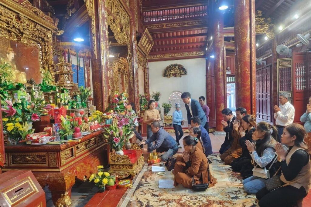 Tet Holiday in Vietnam: Traditions, Food, Customs, and How Vietnamese Celebrate Lunar New Year 14 Families visiting a temple during Tet in Vietnam