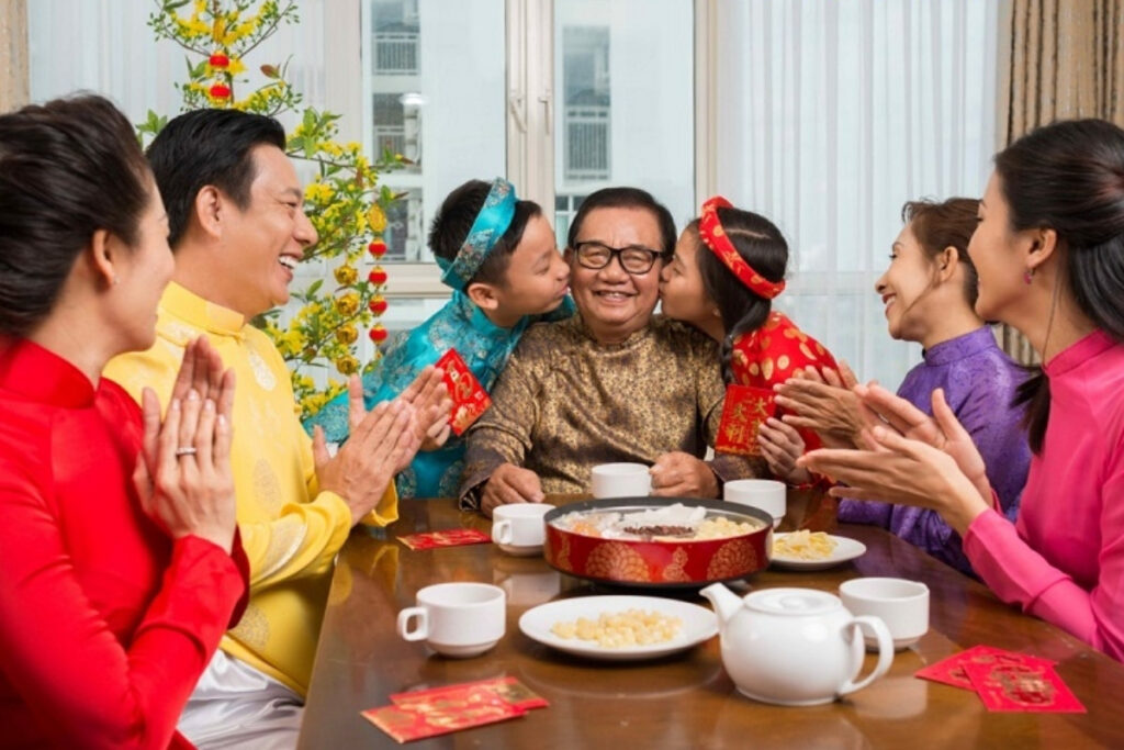 Vietnamese family enjoying tea together