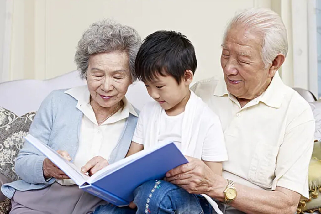Grandfather sharing stories with grandchildren