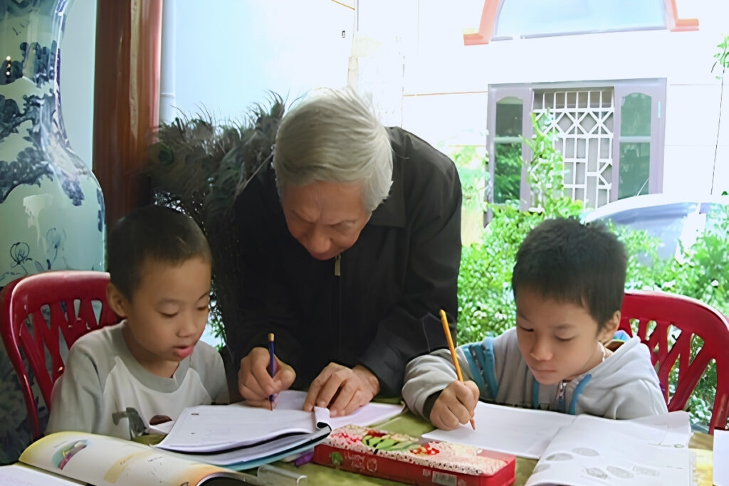 Vietnamese parents helping their child study