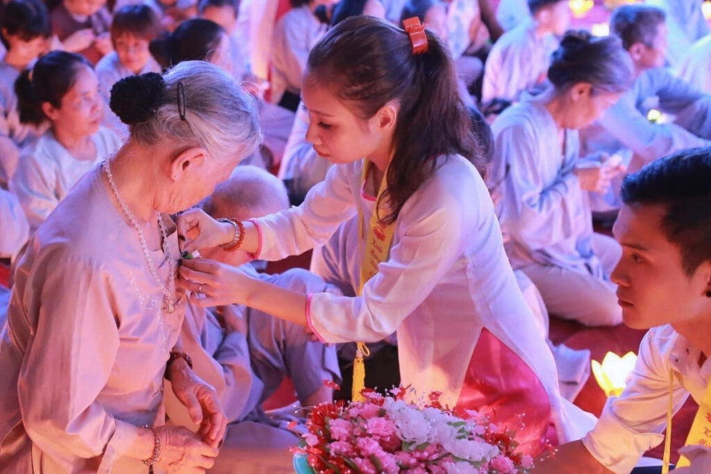 Rose ceremony during Vu Lan Festival at a Vietnamese pagoda