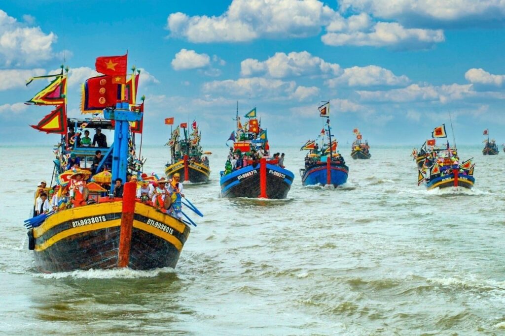 Fishing boats decorated for the Whale Festival in coastal Vietnam