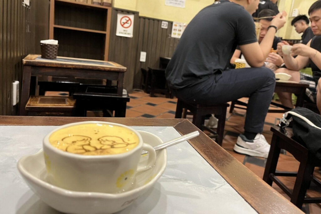 Hanoi Food Guide: 15 Must-Try Dishes & Where to Eat Like a Local 15 Traditional Hanoi egg coffee topped with creamy whipped egg foam served in a local café.