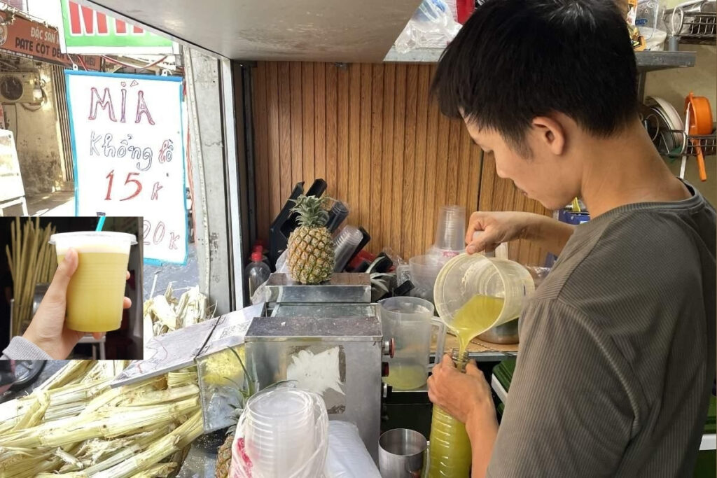 Hanoi Food Guide: 15 Must-Try Dishes & Where to Eat Like a Local 16 Freshly pressed sugarcane juice with ice served by a Hanoi street vendor.