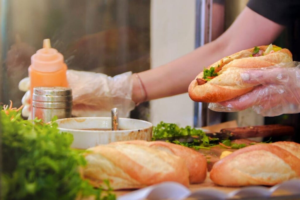 Hanoi Food Guide: 15 Must-Try Dishes & Where to Eat Like a Local 7 Crispy Hanoi banh mi filled with Vietnamese pork, pate, pickled vegetables, cucumber, and herbs.
