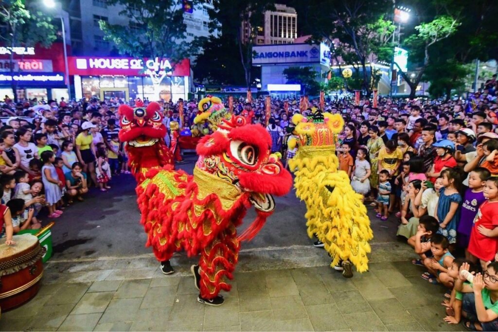 Tet Holiday in Vietnam: Traditions, Food, Customs, and How Vietnamese Celebrate Lunar New Year 12 Traditional lion dance performance during Tet in Vietnam