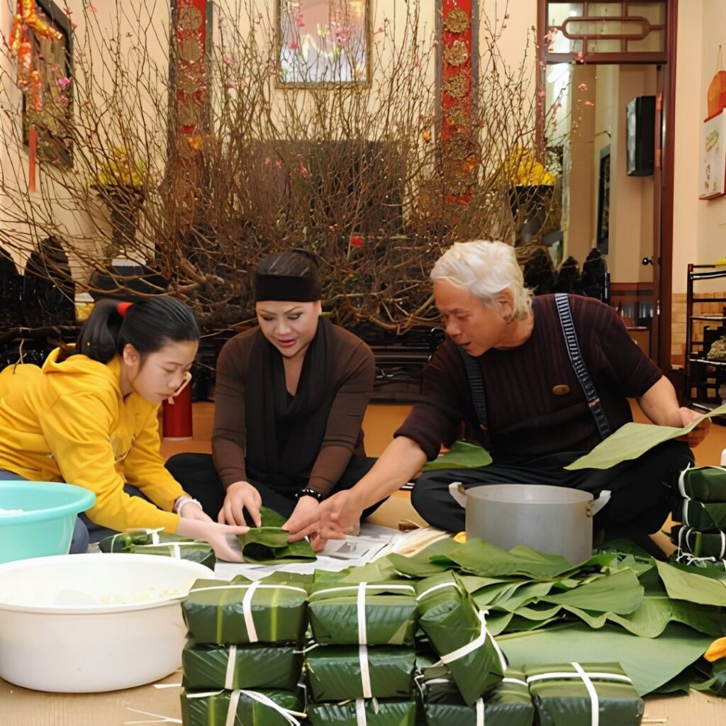 Tet Holiday in Vietnam: Traditions, Food, Customs, and How Vietnamese Celebrate Lunar New Year 11 Vietnamese family wrapping Banh Chung together before Tet