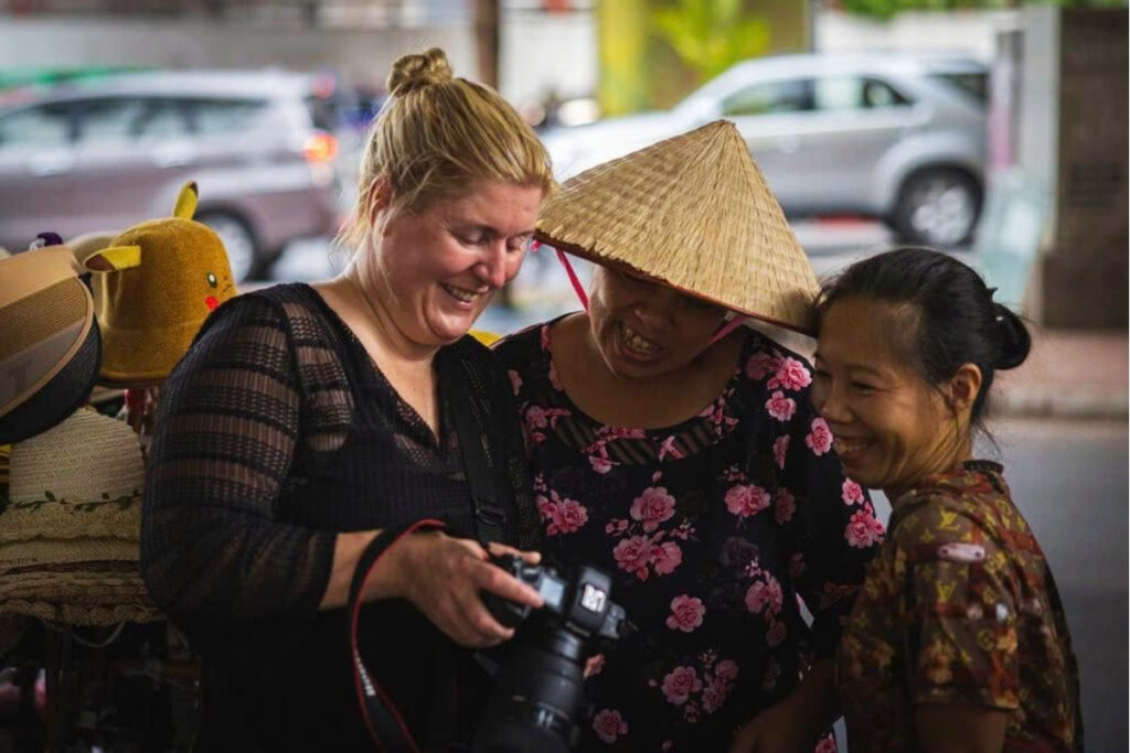 Vietnamese Etiquette Guide: 25 Cultural Tips Every Traveler Should Know Before Visiting Vietnam 14 Traveler asking permission before taking a portrait