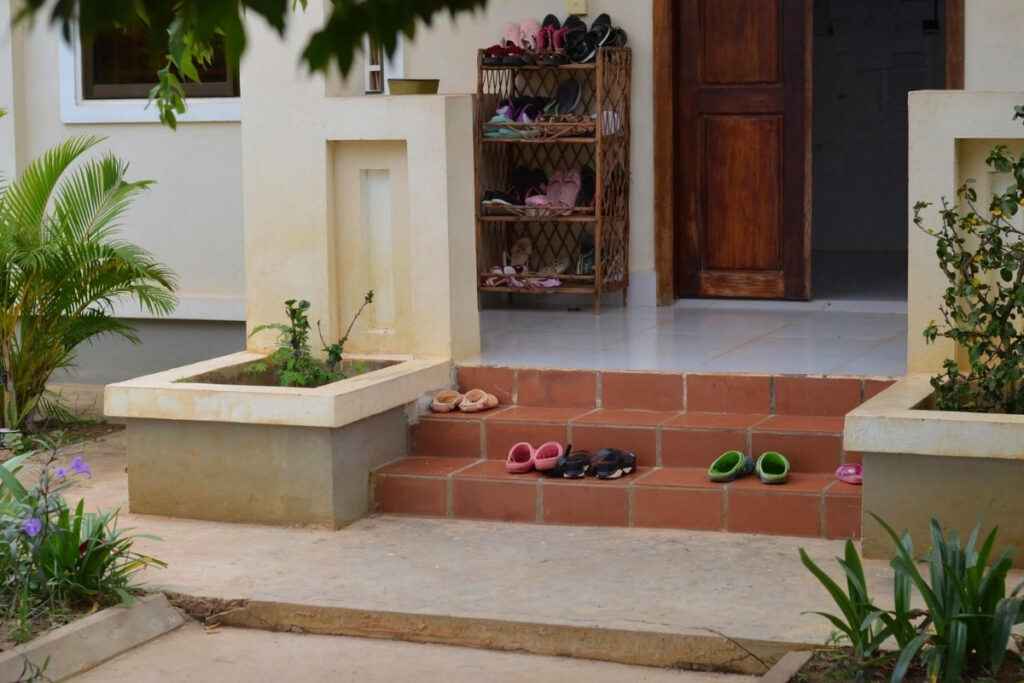 Vietnamese Etiquette Guide: 25 Cultural Tips Every Traveler Should Know Before Visiting Vietnam 5 Shoes neatly arranged outside a Vietnamese home