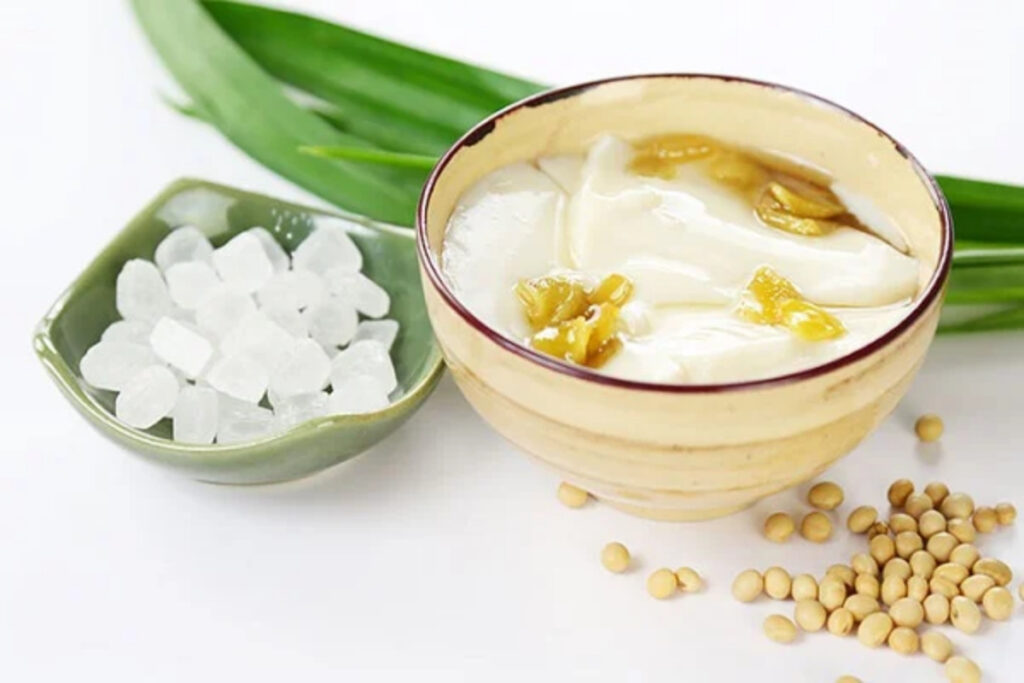Best Vietnamese Desserts: 20 Sweet Treats Every Traveler Should Try in Vietnam 17 Traditional Vietnamese silken tofu dessert served with ginger syrup, coconut milk, and fragrant jasmine flowers.