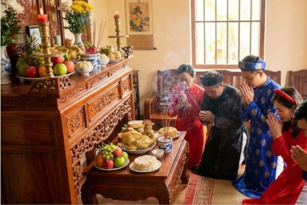 Ancestor Worship in Vietnam: Understanding the Spiritual Tradition That Shapes Vietnamese Life 7 Vietnamese family offering incense during Tet at the ancestor altar