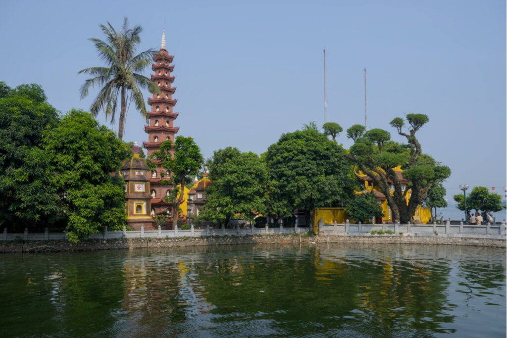 Visitors lighting incense at Tran Quoc Pagoda in Hanoi