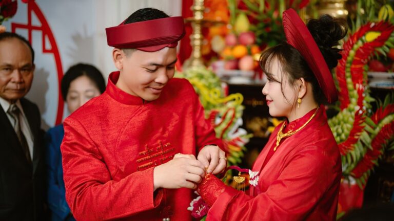 Vietnamese wedding Traditions with bride and groom wearing Ao Dai and ceremonial gift trays