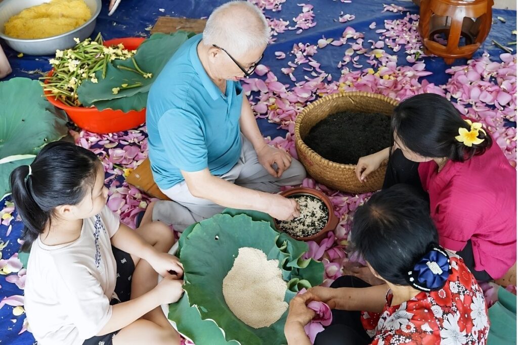 Vietnamese Tea Culture: I Thought Vietnam Was the Land of Coffee—Until an Old Man Handed Me a Tiny Cup of Tea 13 Artisan preparing authentic lotus tea