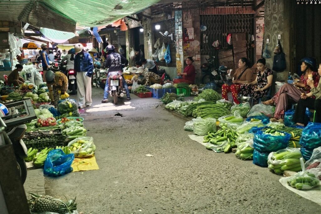 Early morning market in Hanoi filled with local shoppers