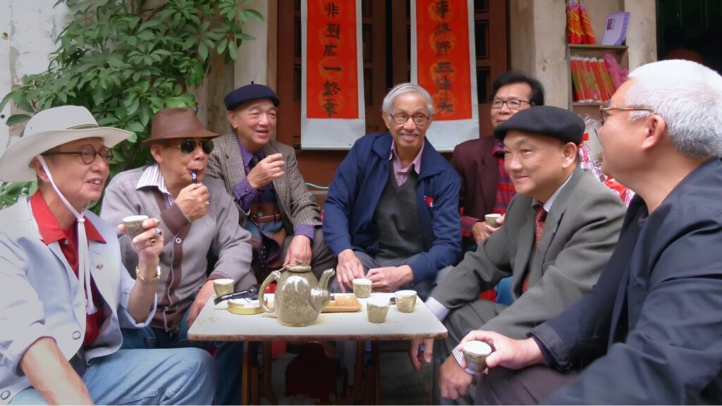Vietnamese Tea Culture: I Thought Vietnam Was the Land of Coffee—Until an Old Man Handed Me a Tiny Cup of Tea 2 Elderly Vietnamese man welcoming a visitor with green tea.