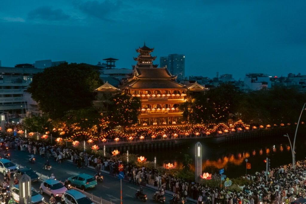 Vietnamese Religion & Beliefs: A Complete Guide to Faith, Spirituality, and Daily Life in Vietnam (2026) 13 Modern skyline beside a historic pagoda