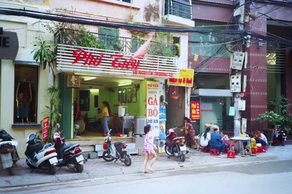 Small local restaurant with diners in Vietnam