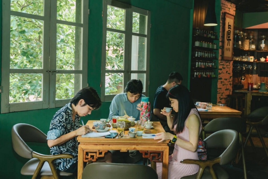 Vietnamese Tea Culture: I Thought Vietnam Was the Land of Coffee—Until an Old Man Handed Me a Tiny Cup of Tea 18 Young Vietnamese enjoying tea in a modern tea house.