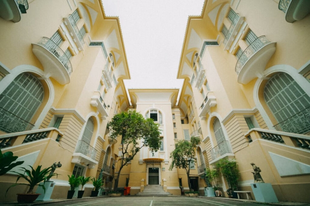 Vietnamese Architecture: A Traveler’s Guide to Traditional, Colonial & Modern Design 7 French colonial architecture in Hanoi Vietnam with balconies and tiled roof