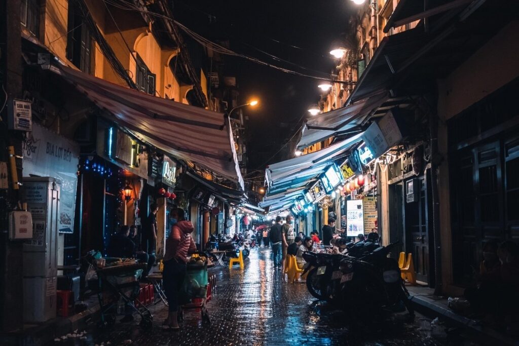 Motorbikes navigating a narrow street in Vietnam