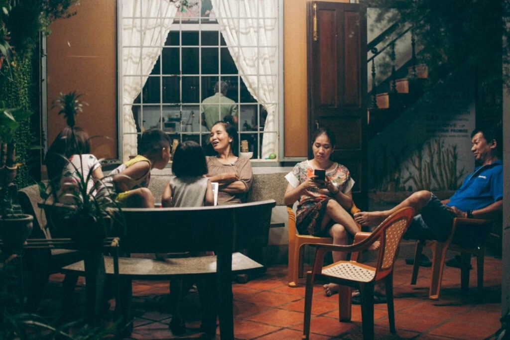 Three generations of a Vietnamese family spending time together