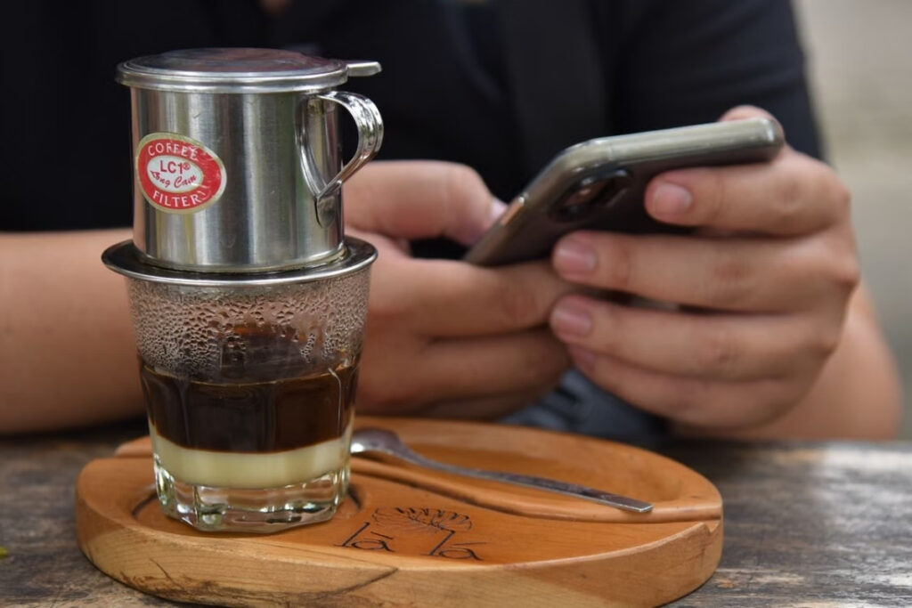 Traditional Vietnamese phin filter brewing coffee