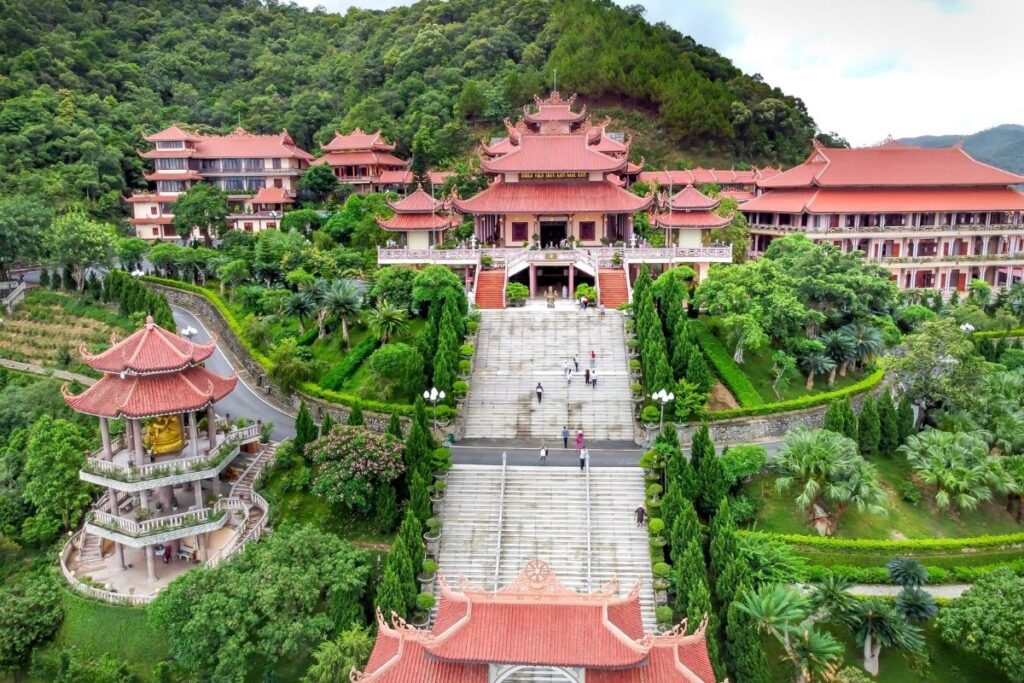 Vietnamese Architecture: A Traveler’s Guide to Traditional, Colonial & Modern Design 3 Traditional Vietnamese Buddhist pagoda with tiled roof and courtyard