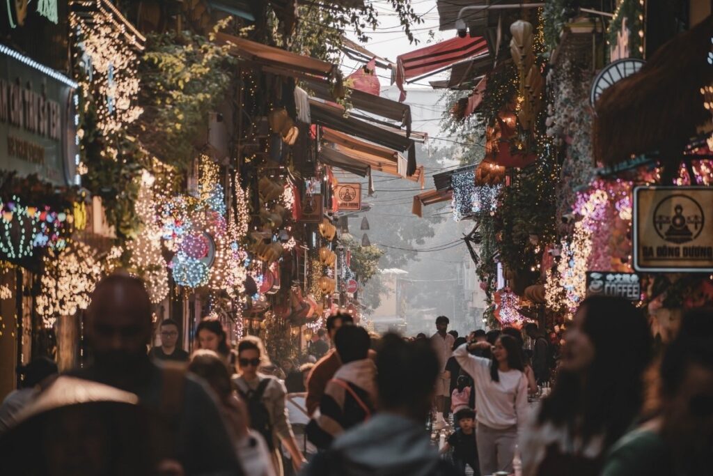 Evening street life and local food stalls in Hanoi Vietnam