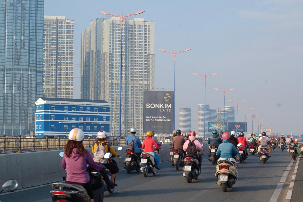 Motorbikes moving through a growing Vietnamese city