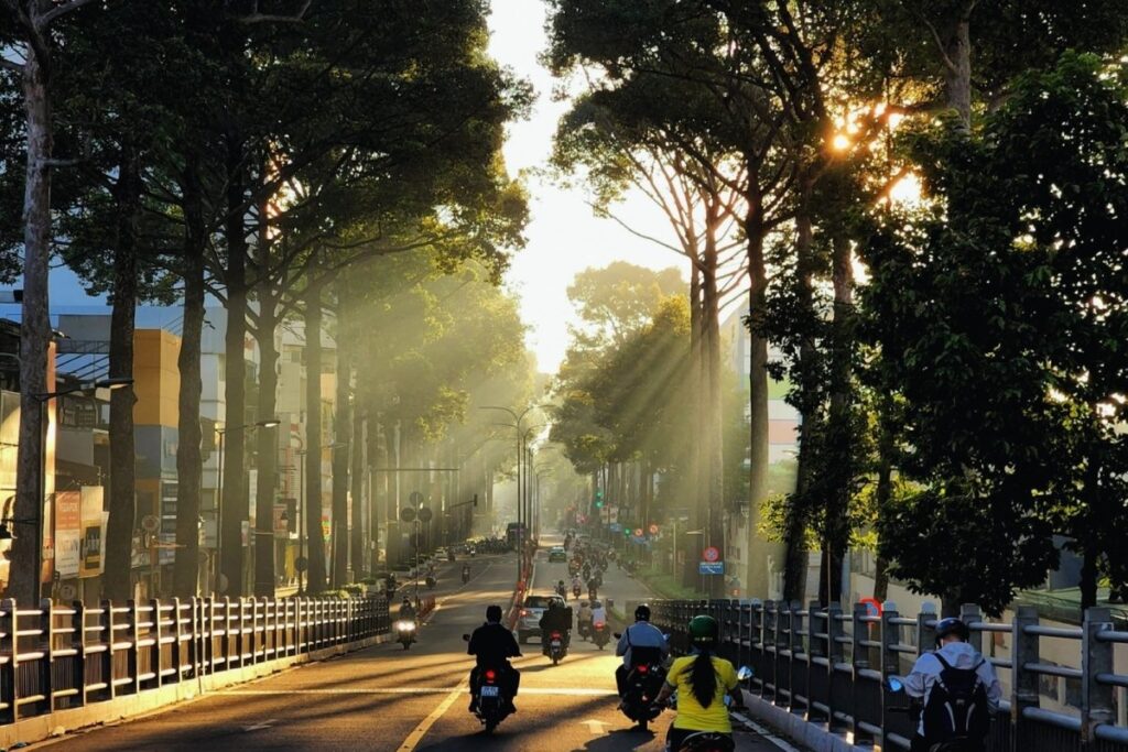 Vietnamese commuters riding motorbikes in the morning