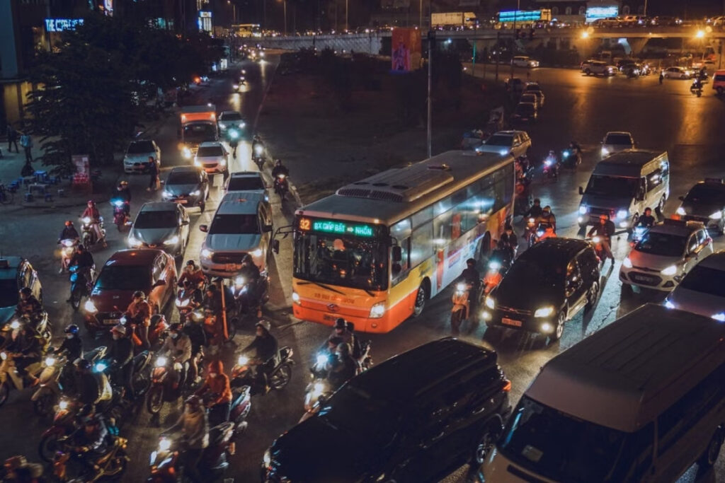 Motorbike traffic flowing through a busy street in Vietnam