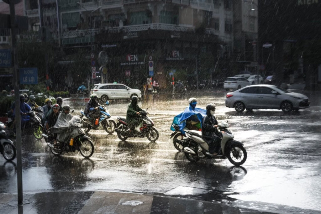 Motorbikes and rain ponchos during everyday life in Vietnam