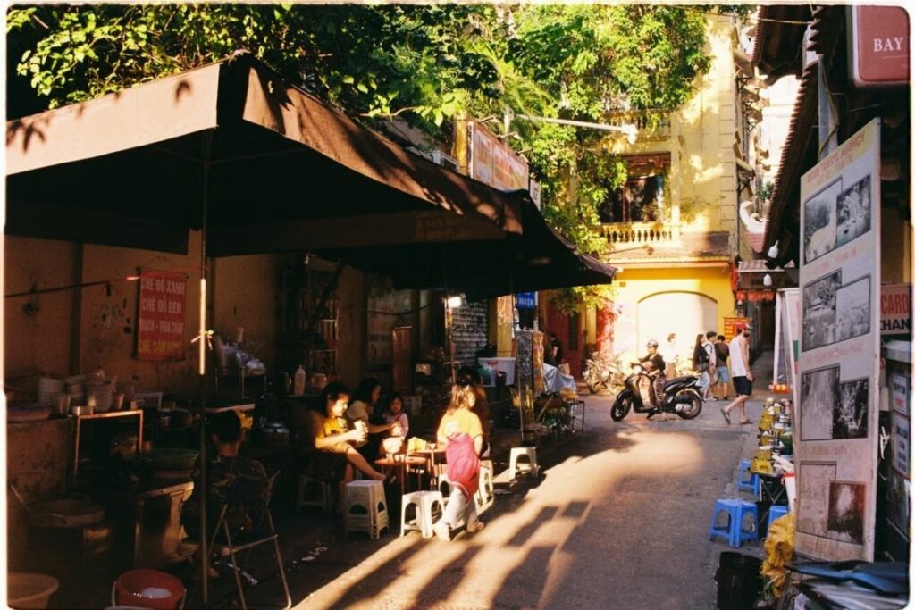 Vietnamese sidewalk used for eating, socializing, and everyday life