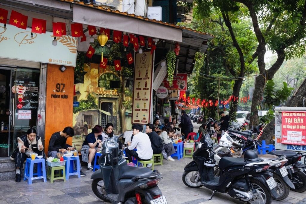 Sidewalk café and everyday street life in Hanoi Vietnam