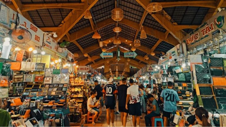 Vietnamese Markets & Bargaining Culture: Traditional morning market in Vietnam with local vendors selling leather produce