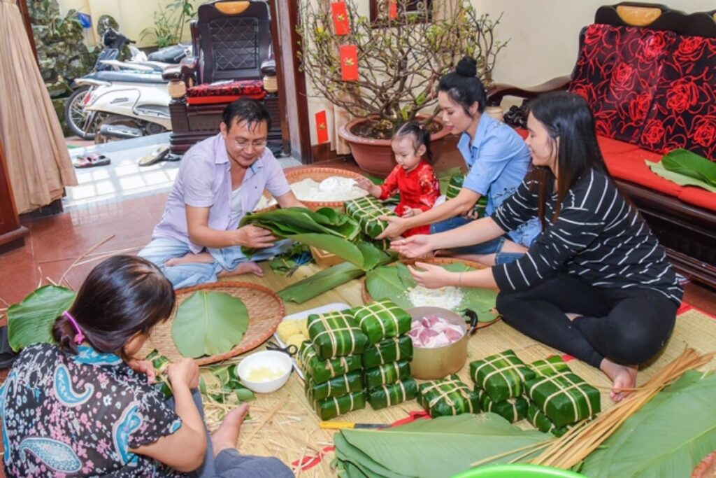 Vietnamese family making banh chung for Tet