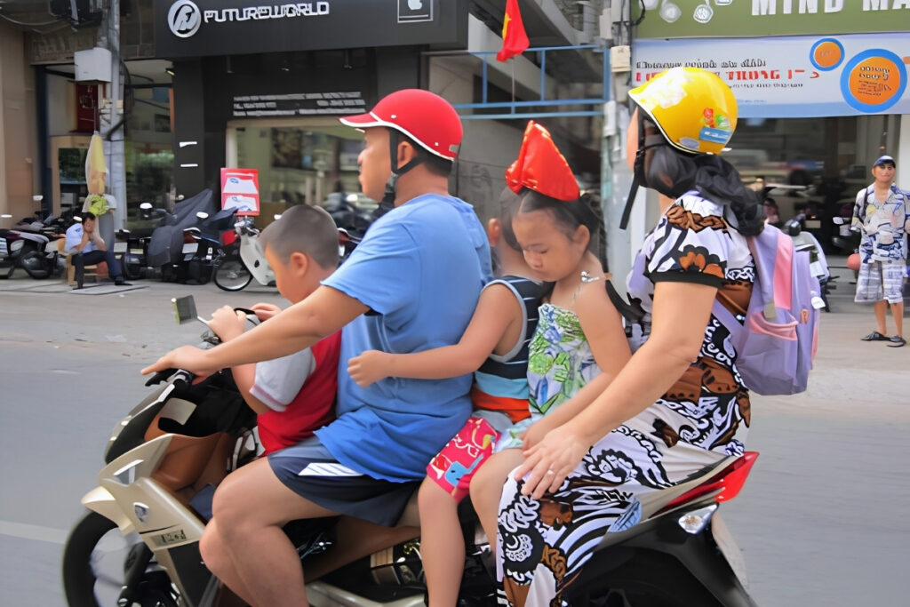 Vietnamese family traveling by motorbike