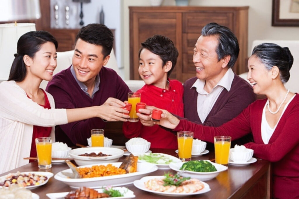Why Do Vietnamese Families Eat Together? 8 Vietnamese grandparents parents and children sharing a meal