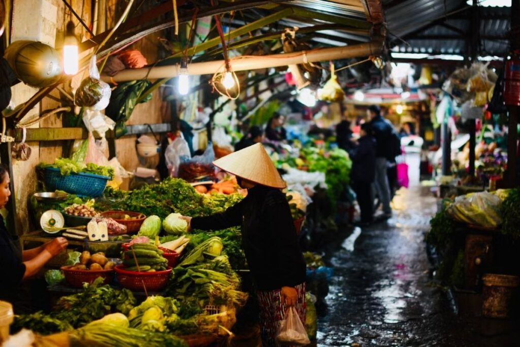 Fresh herbs and vegetables at a Vietnamese market supplying street food vendors