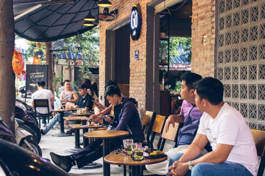 Locals sitting at a Vietnamese sidewalk coffee cafe