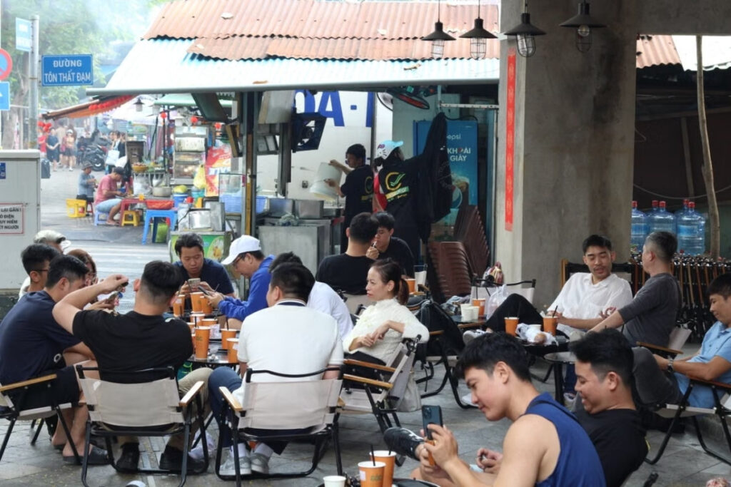 Vietnamese and foreign residents having a casual conversation in Vietnam