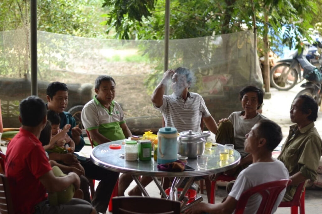 Vietnamese people having a friendly conversation in everyday life