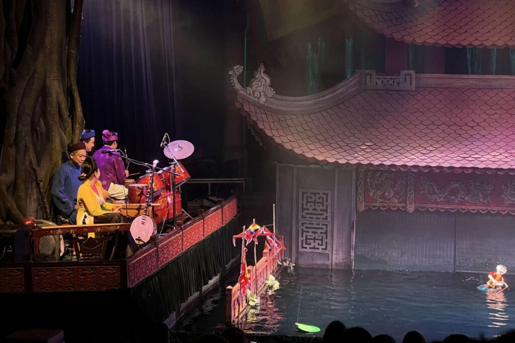 Vietnamese Water Puppet Show Guide: What to Expect & Where to Go 8 Traditional Vietnamese musicians accompanying a water puppet performance