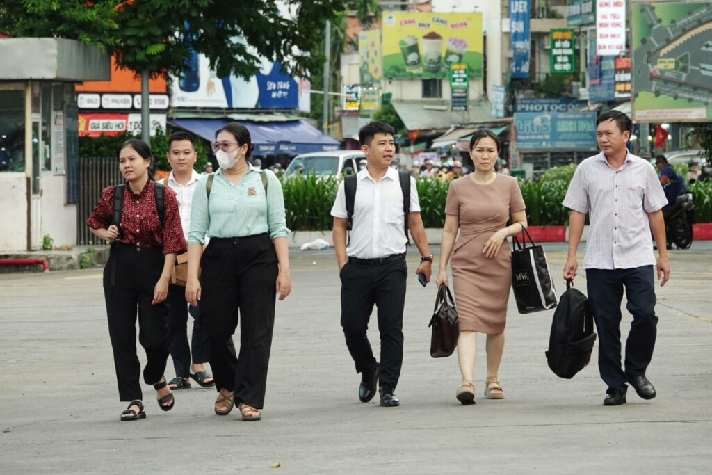 Vietnamese colleagues leaving work in Hanoi at the end of the day