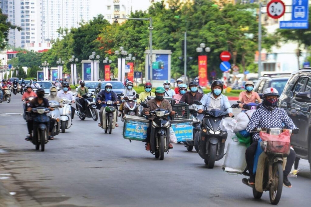 Vietnamese workers commuting through Hanoi in the early morning