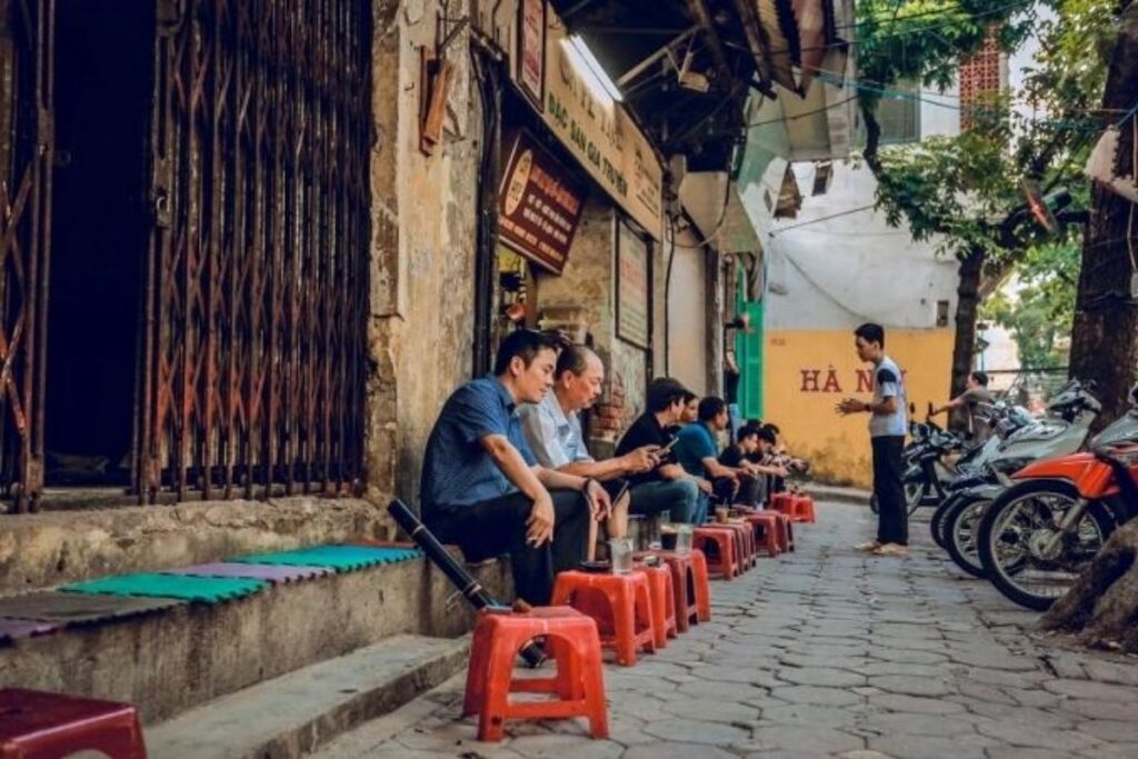 Everyday neighborhood life seen from a coffee shop in Vietnam